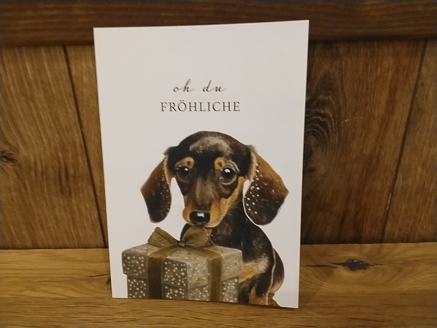 Weihnachten: Klappkarte „Dackel mit Geschenk“